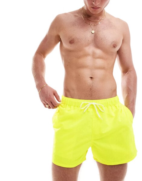 ASOS DESIGN swim short in short length in neon yellow