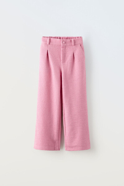 Textured trousers with pleats