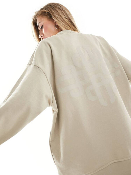 The Couture Club washed emblem sweatshirt in beige