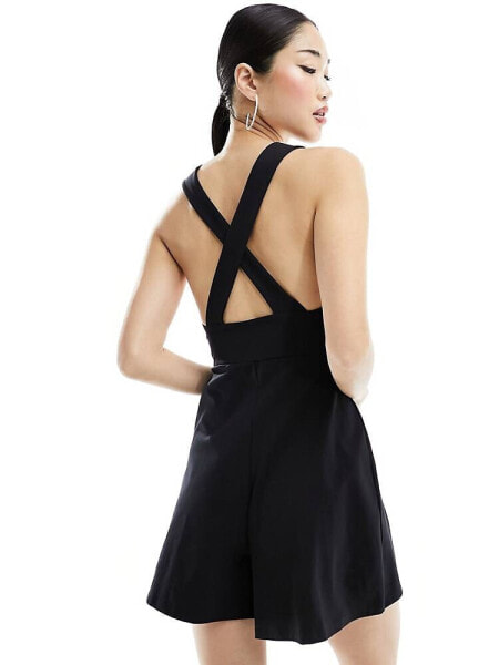 Edited cross back pinafore playsuit in black