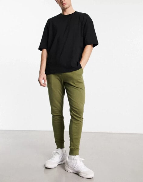 ASOS DESIGN skinny joggers in green