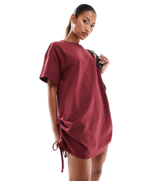 In The Style exclusive ruched side oversized mini t-shirt dress in burgundy