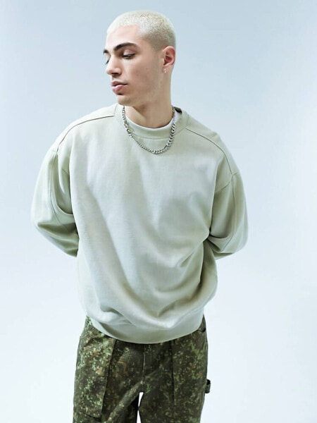 ASOS DESIGN oversized sweatshirt in washed green with seam details