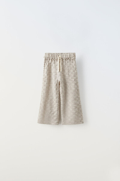 Textured weave trousers with cord