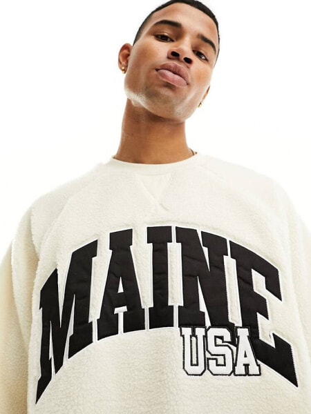 ASOS DESIGN oversized sweatshirt with city print in off white borg