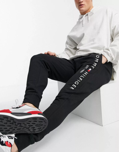 Tommy Hilfiger embroidered logo cuffed joggers in black