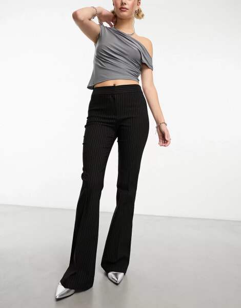 COLLUSION mid rise extreme flare trouser in pinstripe