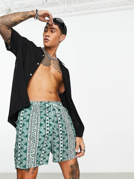 ASOS DESIGN swim shorts in short length with aztec print