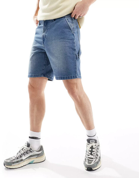 ADPT loose fit denim cargo shorts in mid wash