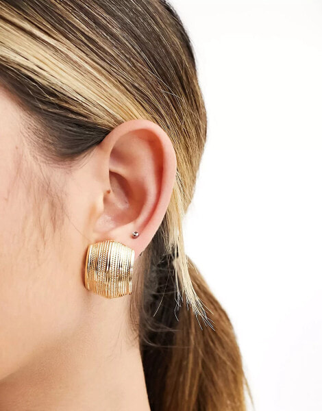 ASOS DESIGN stud earrings with vintage look curved ridged detail in gold tone