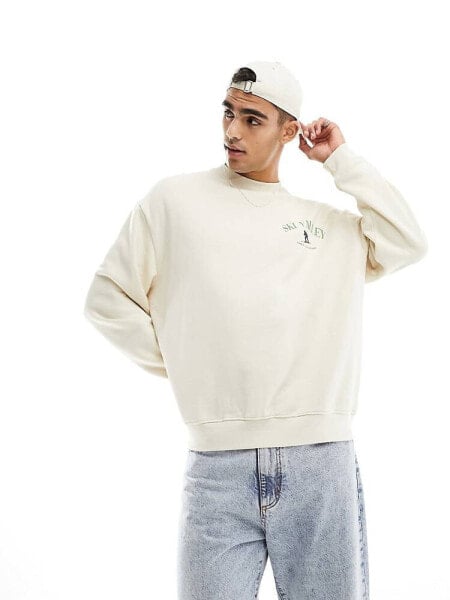 ASOS DESIGN oversized sweatshirt in off white with ski chest print