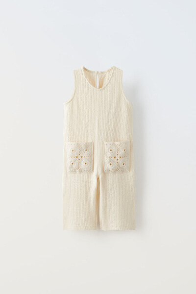 Jumpsuit with crochet pockets