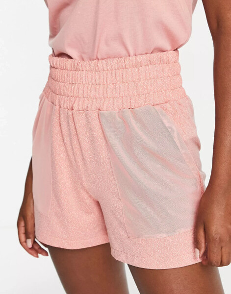 Puma Training shorts with mesh pockets in pink micro print