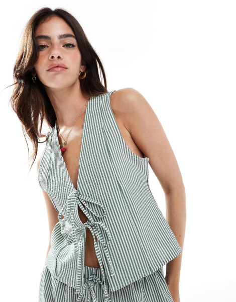 ASOS DESIGN tie front waist coat in green stripe