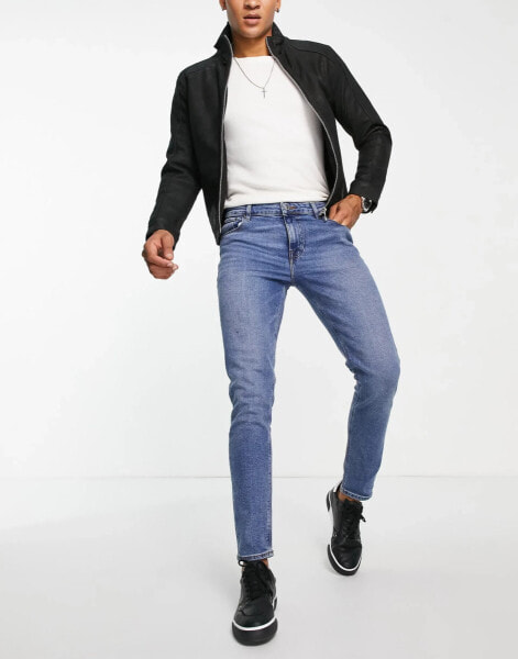 ASOS DESIGN – Skinny-Jeans in mittelblauer Vintage-Waschung