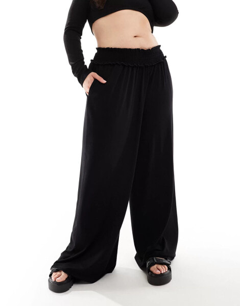 ASOS DESIGN Curve shirred waist wide leg trouser in black