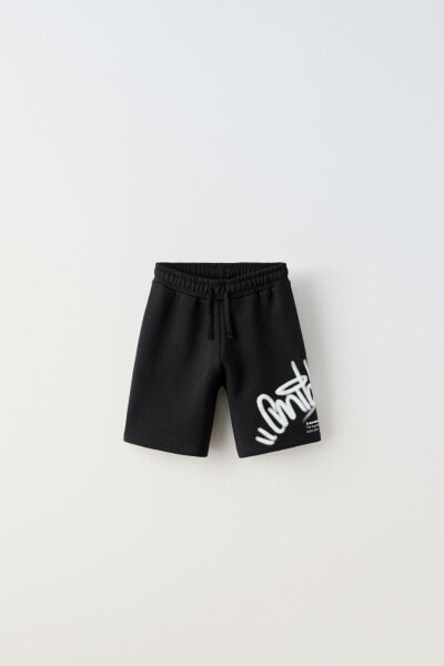 Plush bermuda shorts with graffiti print