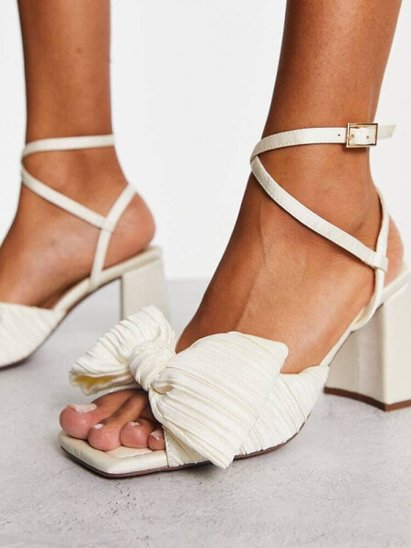 ASOS DESIGN Hitched bow detail mid heeled sandals in ivory 