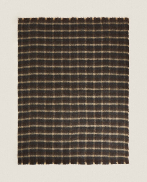 Frayed checked throw