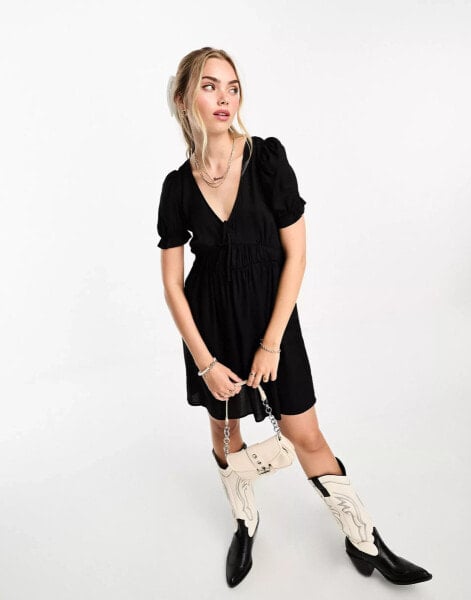 Monki mini smock dress with puff sleeves in black