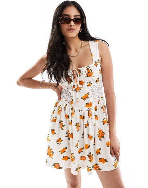 ASOS DESIGN square neck ruched bust mini dress with lace inserts in orange fruit print