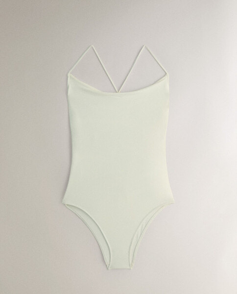 Beach swimsuit with draped detail