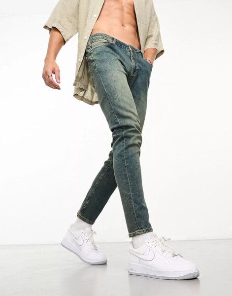 ASOS DESIGN skinny jeans in Y2k heavy tinted mid wash blue