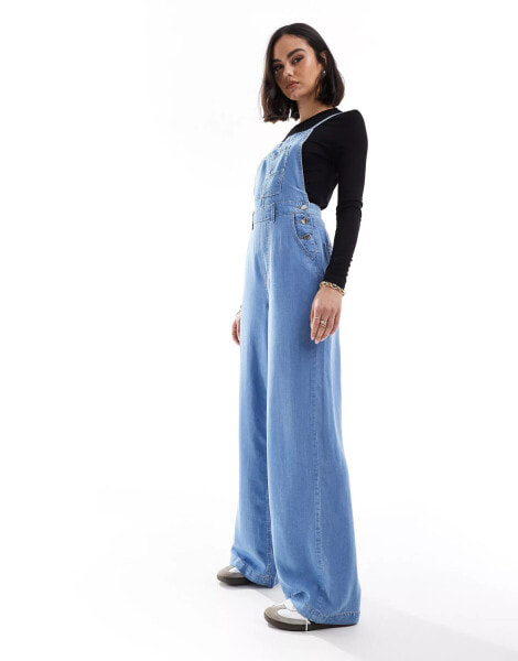 Stradivarius soft touch denim jumpsuit with cross back in light blue