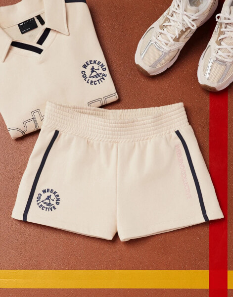 ASOS Weekend Collective heavyweight jersey embroidered shorts with graphic in buttermilk co-ord