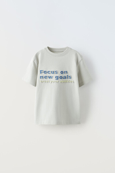 T-shirt with embossed slogan