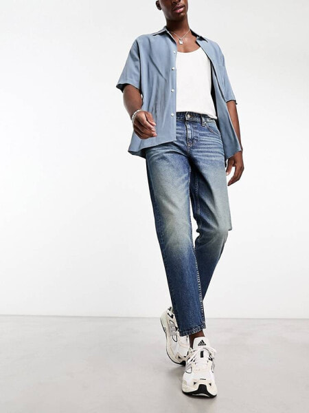 ASOS DESIGN – Skater-Jeans in verwaschenem Dunkelblau mit Tönung