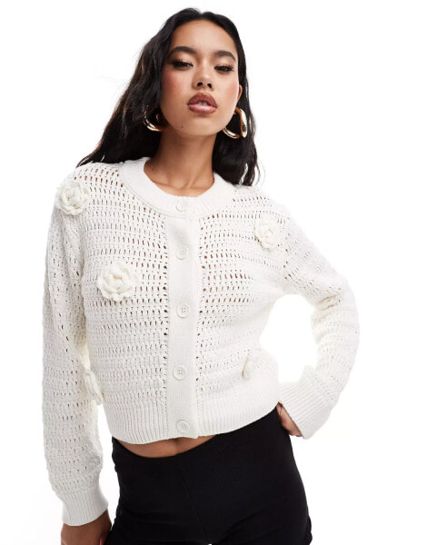 ASOS DESIGN knitted crew neck cardigan in open stitch with crochet flower detail in cream