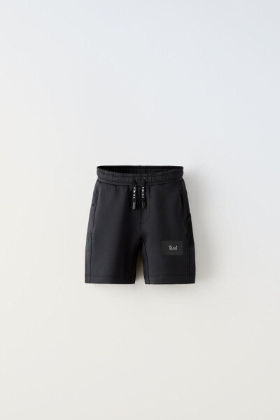 Sporty technical bermuda shorts