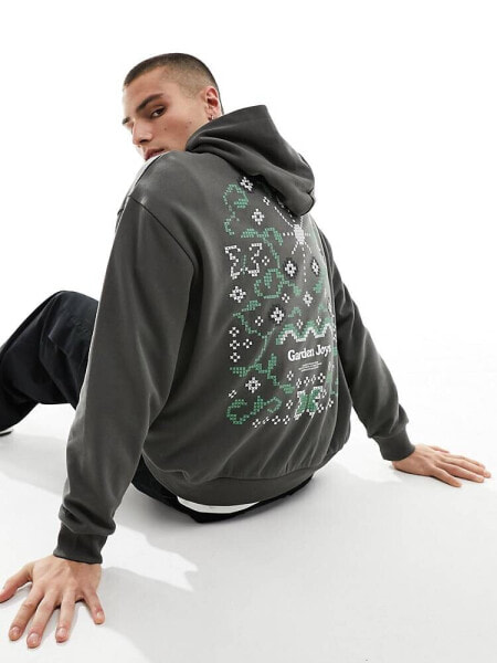 ASOS DESIGN oversized hoodie in khaki with floral back print