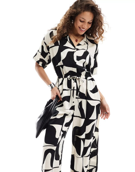 Monki tie waist jumpsuit in black and white puzzle print