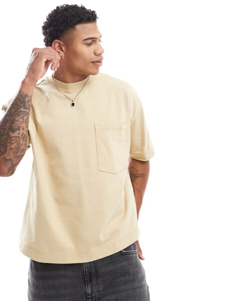 ASOS DESIGN heavyweight oversized boxy t-shirt with front pocket in yellow