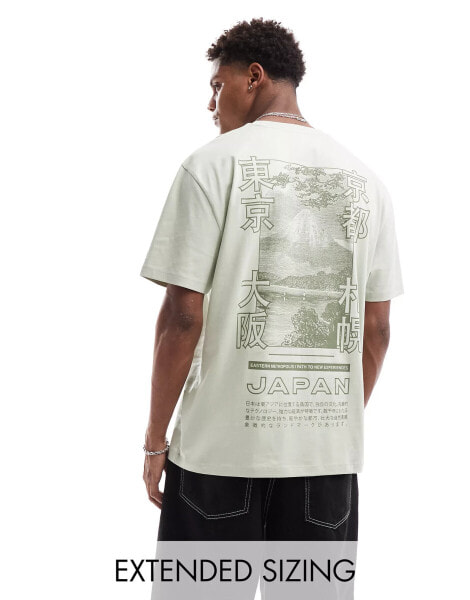 ASOS DESIGN relaxed t-shirt in green with souvenir back print