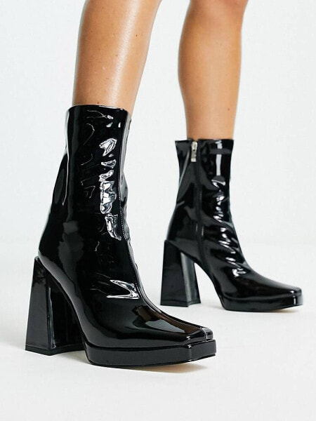 RAID Vista heeled sock boots in black vinyl