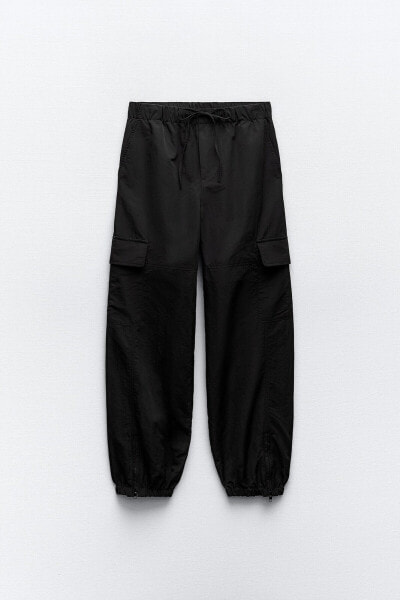 Nylon trousers with zips