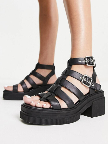 ASOS DESIGN Highway chunky mid heeled sandals in black 