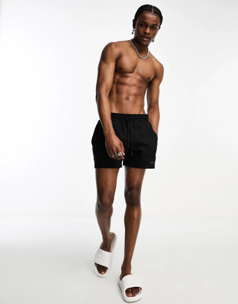 COLLUSION shorter length swim short in black