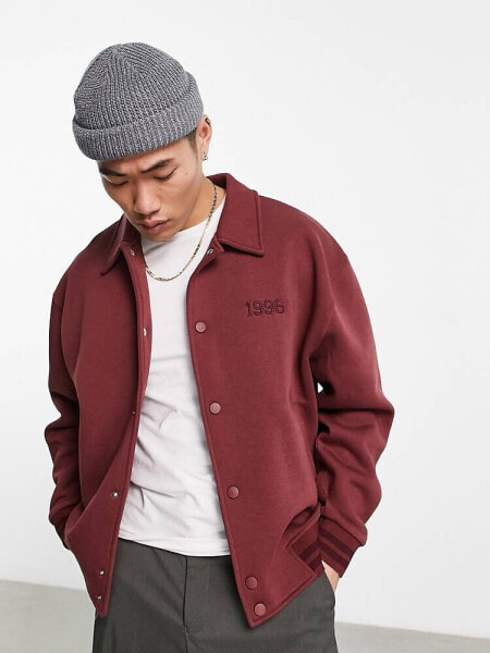 ASOS DESIGN oversized varsity jersey jacket in maroon with back boucle embroidery