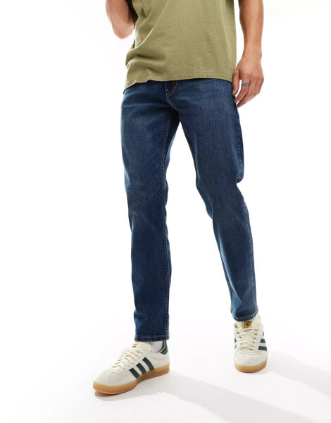 Levi's 502 tapered fit jeans in mid blue