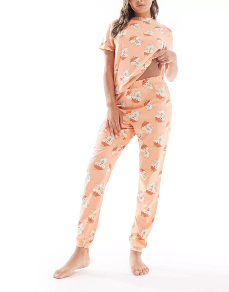 ASOS DESIGN strawberry Cavachon dog tee and cuffed trouser pyjama set in pink