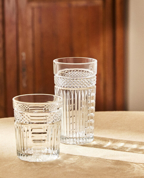 Glass soft drink tumbler with raised design