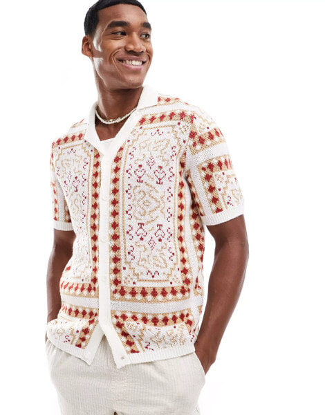 ASOS DESIGN knitted short sleeve button through polo in stone paisley pattern