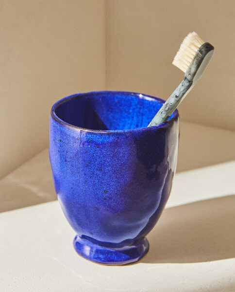 Blue toothbrush holder