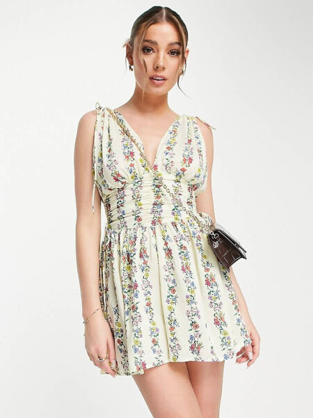 ASOS DESIGN ruched flippy playsuit in linear floral