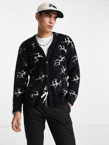HUF cracked cardigan in black with all over print