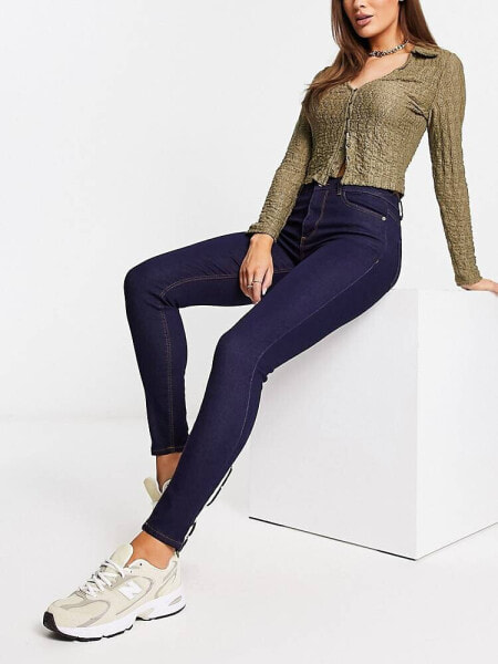 New Look mid rise skinny jeans in dark blue